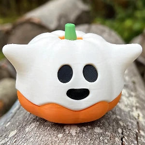 White ghost emerging from an orange pumpkin